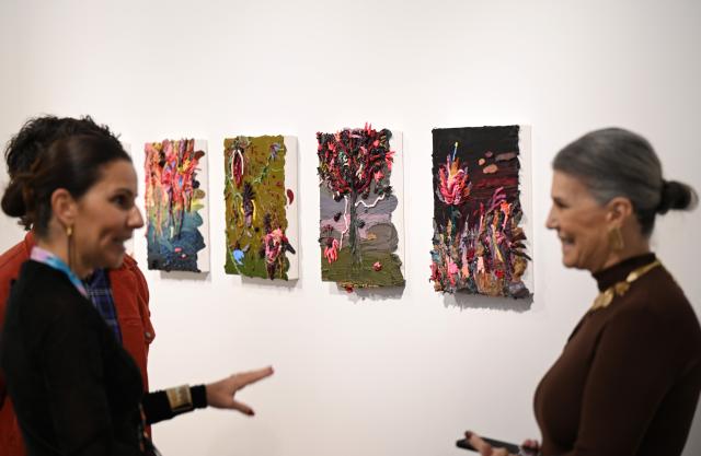(260917) -- RIO DE JANEIRO, Sept. 17, 2026 (Xinhua) -- Visitors communicate during the ArtRio 2026 in Rio de Janeiro, Brazil, Sept. 16, 2026. The five-day fair kicked off here on Wednesday, showcasing contemporary artworks such as paintings, sculptures and art installations from around the world. (Xinhua/Jin Haoyuan)