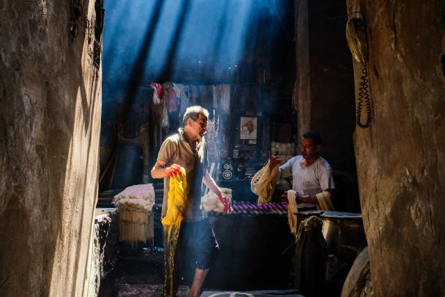 (260917) -- CAIRO, Sept. 17, 2026 (Xinhua) -- Craftsmen work at a traditional dyehouse in Cairo, Egypt, Sept. 16, 2026. Established in 1901, Uncle Salama's Dyehouse is among the few remaining traditional dye houses in Egypt. As industrial textile production has expanded, such workshops have become increasingly rare. (Xinhua/Xin Mengchen)