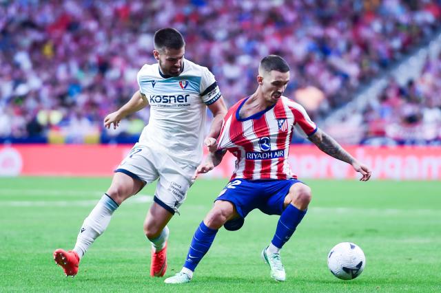 (260917) -- MADRID, Sept. 17, 2026 (Xinhua) -- Atletico de Madrid's Alex Grimaldo (R) vies with Osasuna's Inigo Arguibide during the La Liga football match between Atletico de Madrid and Osasuna at Riyadh Air Metropolitano stadium, in Madrid, Spain, on Sept. 16, 2026. (Photo by Gustavo Valiente/Xinhua)