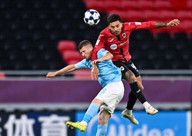 (260917) -- RAYYAN, Sept. 17, 2026 (Xinhua) -- Gregore De Magalhaes (R) of AL Rayyan SC vies with Anas Hammad of Al Faisaly SC during the AFC Champions League Two Group C football match between Qatar's AL Rayyan SC and Jordan's Al Faisaly SC at Ahmad Bin Ali Stadium in Al Rayyan, Qatar, Sept. 16, 2026. (Photo by Nikku/Xinhua)