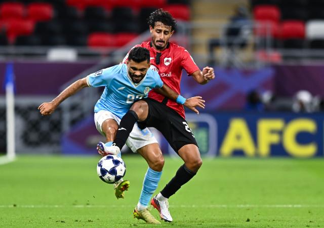 (260917) -- RAYYAN, Sept. 17, 2026 (Xinhua) -- Ahmed Alganehi (R) of AL Rayyan SC vies with Salaah Al Yahyaei of Al Faisaly SC during the AFC Champions League Two Group C football match between Qatar's AL Rayyan SC and Jordan's Al Faisaly SC at Ahmad Bin Ali Stadium in Al Rayyan, Qatar, Sept. 16, 2026. (Photo by Nikku/Xinhua)