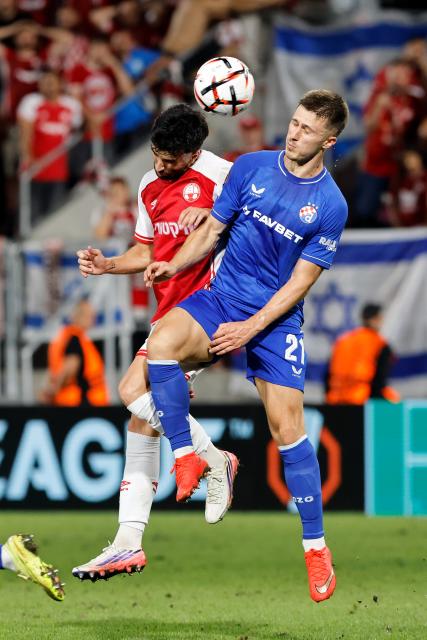 (260917) -- BUCHAREST, Sept. 17, 2026 (Xinhua) -- Hapoel Beer-Sheva's Pedro Amador (L) vies with GNK Dinamo's Mateo Lisica during the UEFA Europa League football match between Hapoel Beer-Sheva and GNK Dinamo in Bucharest, Romania, Sept. 16, 2026. (Photo by Cristian Cristel/Xinhua)