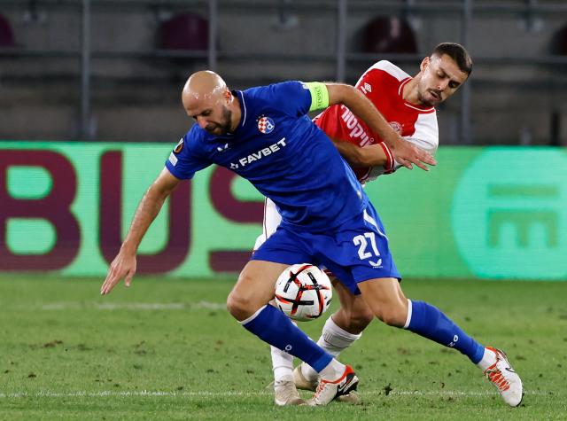 (260917) -- BUCHAREST, Sept. 17, 2026 (Xinhua) -- Hapoel Beer-Sheva's Zahi Ahmad (R) vies with GNK Dinamo's Josip Misic during the UEFA Europa League football match between Hapoel Beer-Sheva and GNK Dinamo in Bucharest, Romania, Sept. 16, 2026. (Photo by Cristian Cristel/Xinhua)