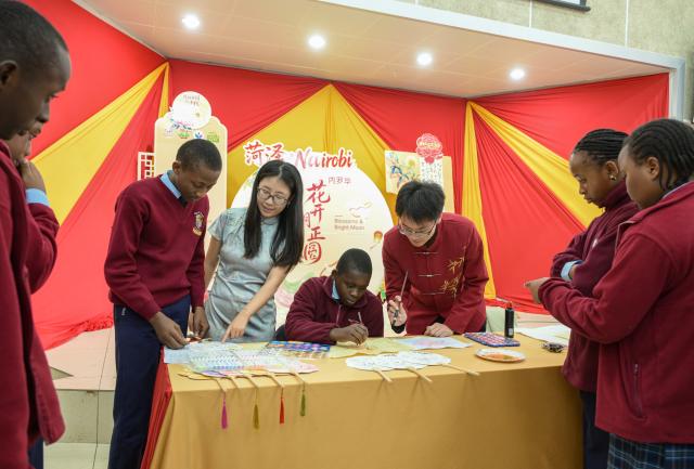 (260917) -- NAIROBI, Sept. 17, 2026 (Xinhua) -- Students try traditional Chinese painting during an event to celebrate the upcoming Mid-Autumn Festival at the Confucius Institute at Kenyatta University in Nairobi, Kenya, Sept. 16, 2026. TO GO WITH "Feature: Kenyan youth embrace China's Mid-Autumn Festival as cultural ties grow" (Xinhua/Yang Guang)