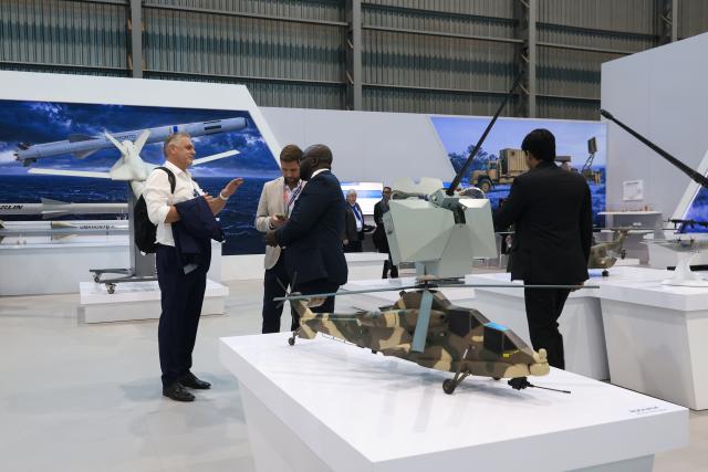 (260917) -- PRETORIA, Sept. 17, 2026 (Xinhua) -- People visit the exhibition area of the Africa Aerospace and Defense (AAD) expo in Pretoria, South Africa, Sept. 16, 2026. The 25th AAD expo kicked off at Air Force Base Waterkloof here on Wednesday, and the event will run until Sept. 20. (Xinhua/Chen Wei)