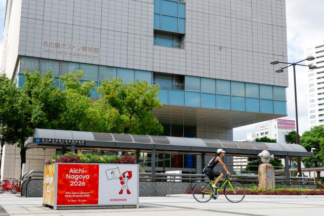(260917) -- NAGOYA, Sept. 17, 2026 (Xinhua) -- A man rides by a flowerbed with decorations for the 20th Asian Games Aichi-Nagoya 2026 in Nagoya, Japan, Sept. 17, 2026. (Xinhua/Wu Zhizun)