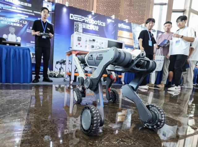 (260917) -- HANGZHOU, Sept. 17, 2026 (Xinhua) -- A robot is seen during the 9th China Robotop Summit in Hangzhou, east China's Zhejiang Province, Sept. 17, 2026.
  This summit kicked off at Hangzhou Future Sci-Tech City here on Thursday.
   Themed "Smart Connectivity for a New Ecosystem, Empowering All Scenarios: The Intelligent and Qualitative Transformation in the 'Robot+' Era," the event served as a premier platform for academic exchange, industrial matchmaking, and exhibition within the robotics sector.
   The summit featured five major exhibition zones: humanoid robots and embodied intelligence, industrial robots, service and special-purpose robots, medical robots, and the robotics industry chain. (Xinhua/Xu Yu)