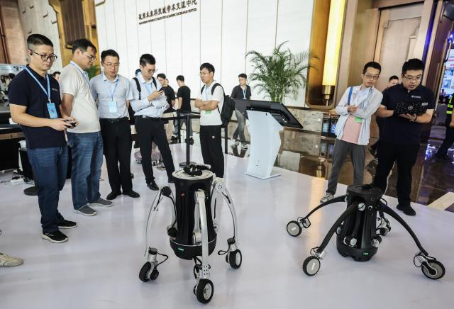 (260917) -- HANGZHOU, Sept. 17, 2026 (Xinhua) -- Robots are seen during the 9th China Robotop Summit in Hangzhou, east China's Zhejiang Province, Sept. 17, 2026.
  This summit kicked off at Hangzhou Future Sci-Tech City here on Thursday.
   Themed "Smart Connectivity for a New Ecosystem, Empowering All Scenarios: The Intelligent and Qualitative Transformation in the 'Robot+' Era," the event served as a premier platform for academic exchange, industrial matchmaking, and exhibition within the robotics sector.
   The summit featured five major exhibition zones: humanoid robots and embodied intelligence, industrial robots, service and special-purpose robots, medical robots, and the robotics industry chain. (Xinhua/Xu Yu)
