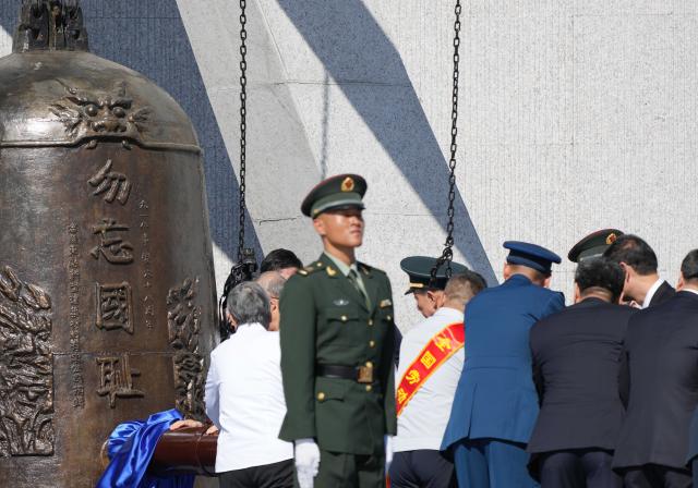 (260918) -- SHENYANG, Sept. 18, 2026 (Xinhua) -- A ceremony to commemorate the September 18 Incident is held at the square of the 9.18 Historical Museum in Shenyang, northeast China's Liaoning Province, Sept. 18, 2026. A bell tolled at the square of the 9.18 Historical Museum in Shenyang on Friday to commemorate the 95th anniversary of the September 18 Incident, which marked the start of the Chinese People's War of Resistance against Japanese Aggression. (Xinhua/Li Gang)