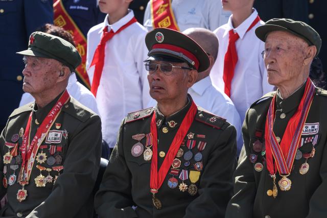 (260918) -- SHENYANG, Sept. 18, 2026 (Xinhua) -- Veterans attend a ceremony commemorating the September 18 Incident at the square of the 9.18 Historical Museum in Shenyang, northeast China's Liaoning Province, Sept. 18, 2026. A bell tolled at the square of the 9.18 Historical Museum in Shenyang on Friday to commemorate the 95th anniversary of the September 18 Incident, which marked the start of the Chinese People's War of Resistance against Japanese Aggression. (Xinhua/Pan Yulong)
