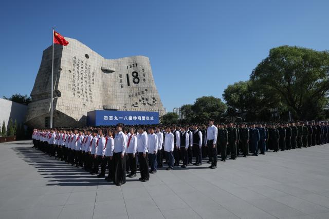 (260918) -- SHENYANG, Sept. 18, 2026 (Xinhua) -- A ceremony to commemorate the September 18 Incident is held at the square of the 9.18 Historical Museum in Shenyang, northeast China's Liaoning Province, Sept. 18, 2026. A bell tolled at the square of the 9.18 Historical Museum in Shenyang on Friday to commemorate the 95th anniversary of the September 18 Incident, which marked the start of the Chinese People's War of Resistance against Japanese Aggression. (Xinhua/Pan Yulong)