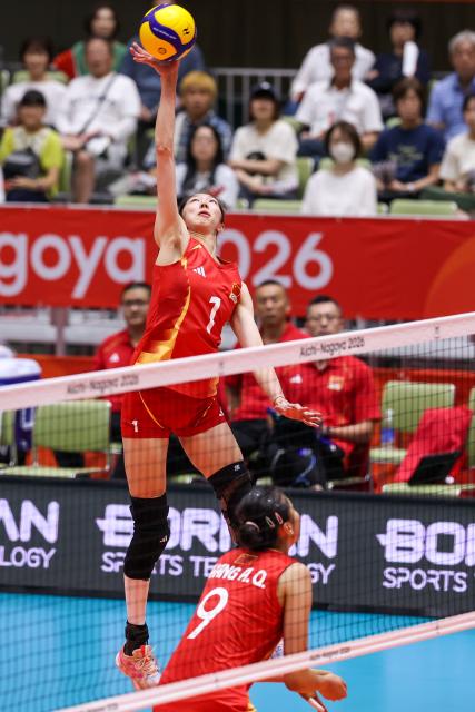 (260918) -- OKAZAKI, Sept. 18, 2026 (Xinhua) -- Wu Mengjie (top) of China spikes the ball during the preliminary round Pool B match of women's volleyball between Kazakhstan and China at the 20th Asian Games Aichi-Nagoya 2026 in Okazaki, Japan, Sept. 18, 2026. (Xinhua/Li Bo)