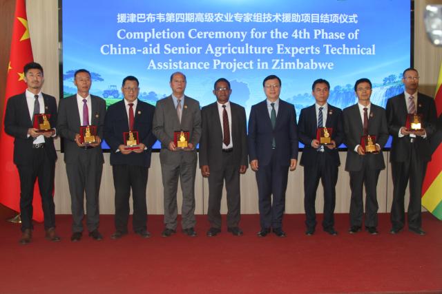 (260918) -- HARARE, Sept. 18, 2026 (Xinhua) -- Chinese agricultural experts receive medals at a ceremony marking the completion of the fourth phase of the China-aid Senior Agriculture Experts Technical Assistance Project in Zimbabwe, held at the Chinese embassy in Harare, Zimbabwe, on Sept. 17, 2026. Seven Chinese agricultural experts were awarded special contribution medals by the Zimbabwean government on Thursday in recognition of their pivotal role in advancing Zimbabwe's agriculture sector.
  TO GO WITH "Roundup: Chinese agricultural experts honored for contributions to Zimbabwe's agriculture" (Xinhua/Tafara Mugwara)