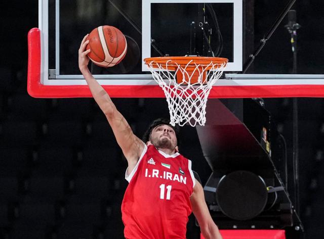 (260918) -- NAGOYA, Sept. 18, 2026 (Xinhua) -- Mohammad Heydari (C) of Iran dunks during the men's semifinal basketball match between South Korea and Iran at the 20th Asian Games Aichi-Nagoya 2026 in Nagoya, Japan, Sept. 18, 2026. (Xinhua/Luo Yuan)