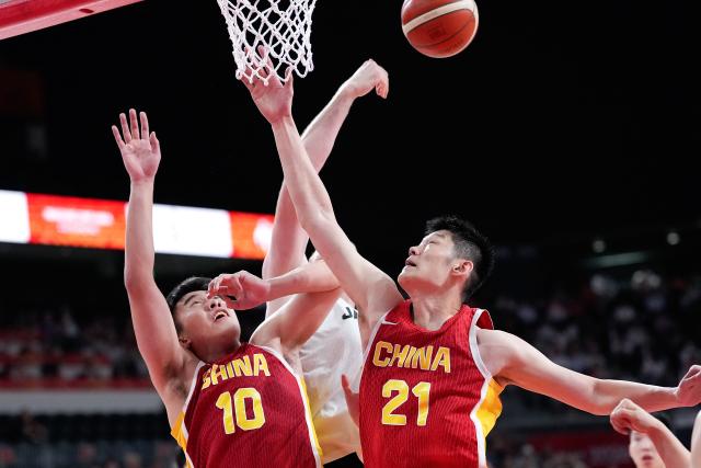(260918) -- NAGOYA, Sept. 18, 2026 (Xinhua) -- Wang Junjie (L) and Hu Jinqiu (R) of China compete during the men's semifinal basketball match between China and Japan at the 20th Asian Games Aichi-Nagoya 2026 in Nagoya, Japan, Sept. 18, 2026. (Xinhua/Luo Yuan)