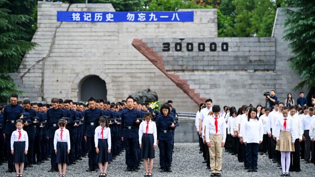 (260918) -- BEIJING, Sept. 18, 2026 (Xinhua) -- People mourn during an event commemorating the 95th anniversary of the September 18 Incident at the Memorial Hall of the Victims in Nanjing Massacre by Japanese Invaders in Nanjing, east China's Jiangsu Province, Sept. 18, 2026. People across China on Friday commemorated the 95th anniversary of the September 18 Incident that marked the start of the Chinese People's War of Resistance against Japanese Aggression. (Photo by Yang Suping/Xinhua)
