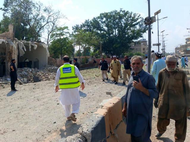 (260918) -- KOHAT, Sept. 18, 2026 (Xinhua) -- This photo taken with mobile phone shows a blast site at Kohat in Pakistan's Khyber Pakhtunkhwa province on Sept. 18, 2026. At least 16 people were killed and over 50 others injured in a twin suicide attack inside a residential compound of police in Pakistan's Khyber Pakhtunkhwa province on Friday, police and rescue officials said. (Str/Xinhua)