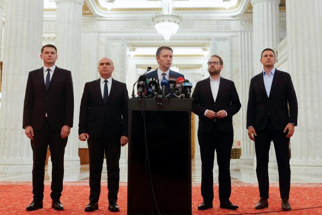 (260918) -- BUCHAREST, Sept. 18, 2026 (Xinhua) -- Romania's Prime Minister-designate Siegfried Muresan (C) delivers a speech to the media at the Parliament Palace in Bucharest, Romania, Sept. 18, 2026. (Photo by Cristian Cristel/Xinhua)