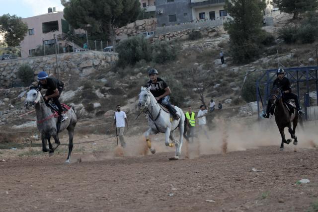 (260918) -- HEBRON, Sept. 18, 2026 (Xinhua) -- Palestinians ride their horses as they compete in a local horse race in al-Majd village, near Dura, south of Hebron, Sept. 18, 2026. (Photo by Mamoun Wazwaz/Xinhua)
