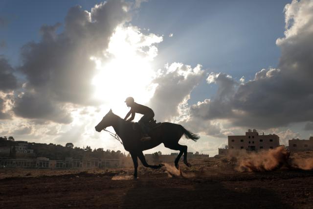 (260918) -- HEBRON, Sept. 18, 2026 (Xinhua) -- A Palestinian rides his horse as he competes in a local horse race in al-Majd village, near Dura, south of Hebron, Sept. 18, 2026. (Photo by Mamoun Wazwaz/Xinhua)