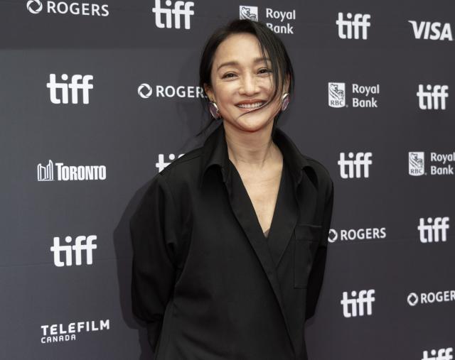 (260919) -- TORONTO, Sept. 19, 2026 (Xinhua) -- Actress Zhou Xun poses for photos at the world premiere of the film "The Road Not Taken" during the 2026 Toronto International Film Festival (TIFF) in Toronto, Canada, on Sept. 18, 2026. (Photo by Zou Zheng/Xinhua)