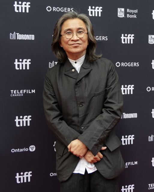 (260919) -- TORONTO, Sept. 19, 2026 (Xinhua) -- Director Peter Ho-Sun Chan poses for photos at the world premiere of the film "The Road Not Taken" during the 2026 Toronto International Film Festival (TIFF) in Toronto, Canada, on Sept. 18, 2026. (Photo by Zou Zheng/Xinhua)
