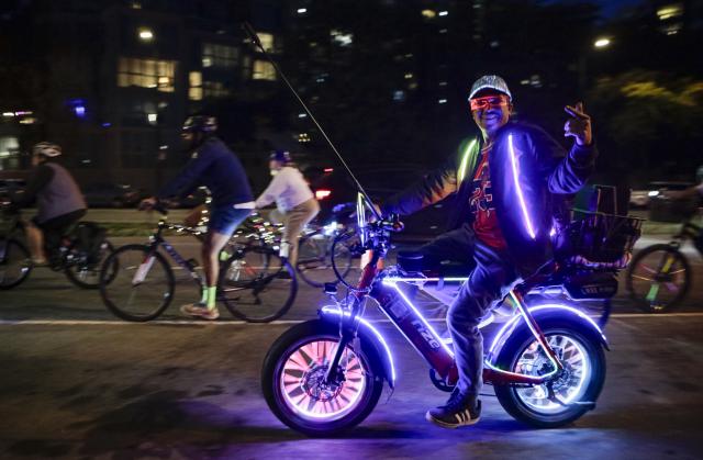 (260919) -- VANCOUVER, Sept. 19, 2026 (Xinhua) -- Cyclists ride along a street on decorated bicycles during the Bike the Night event in Vancouver, British Columbia, Canada, Sept. 18, 2026. The 10-kilometer night cycling event was held here on Friday. (Photo by Liang Sen/Xinhua)