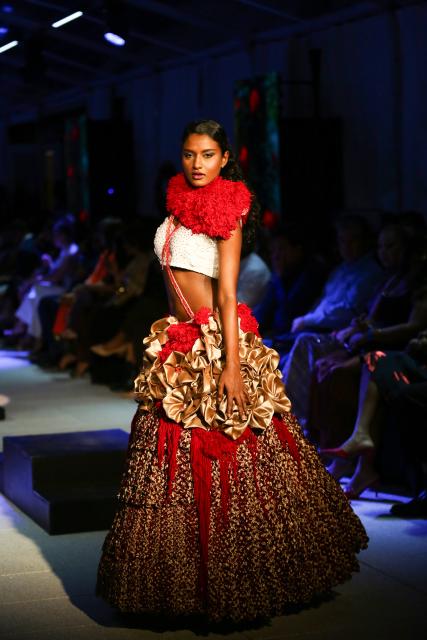 (260919) -- COLOMBO, Sept. 19, 2026 (Xinhua) -- A model showcases a design during the "Couture + Trousseau" special event of Colombo Fashion Week in Colombo, Sri Lanka, on Sept. 17, 2026. The event, running from Sept. 17 to 19, features collections by Sri Lankan designers as well as designers from India, China, and Pakistan. (Photo by Ajith Perera/Xinhua)