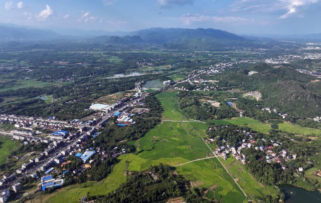 (260919) -- GUILIN, Sept. 19, 2026 (Xinhua) -- An aerial drone photo taken on Aug. 11, 2026 shows a view of the Caiwan Town of Quanzhou County of Guilin City, south China's Guangxi Zhuang Autonomous Region. In the winter of 1934 during the Long March, the Red Army fought its way across the Xiangjiang River in Guangxi and broke through the Kuomintang troops' blockade, but suffered tens of thousands of casualties in the battle.
   In Quanzhou, Guanyang and Xing'an counties, where the Battle of the Xiangjiang River was fought, the spirit of the Long March has been passed down through generations. Today, roads wind through mountains that Red Army soldiers once crossed on foot, connecting once-isolated villages with the outside world. Local people keep striving on the path of rural revitalization. (Xinhua/Huang Xiaobang)