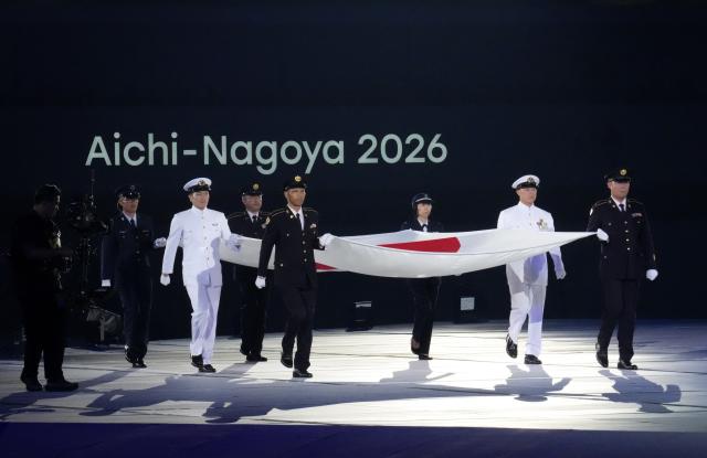 (260919) -- NAGOYA, Sept. 19, 2026 (Xinhua) -- The Japanese national flag is carried during the opening ceremony of the 20th Asian Games Aichi-Nagoya 2026 in Nagoya, Japan, Sept. 19, 2026. (Xinhua/Cen Yunpeng)