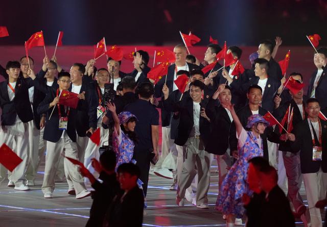 (260919) -- NAGOYA, Sept. 19, 2026 (Xinhua) -- The delegation of China parades into the stadium during the opening ceremony of the 20th Asian Games Aichi-Nagoya 2026 in Nagoya, Japan, Sept. 19, 2026. (Xinhua/Lui Siu Wai)