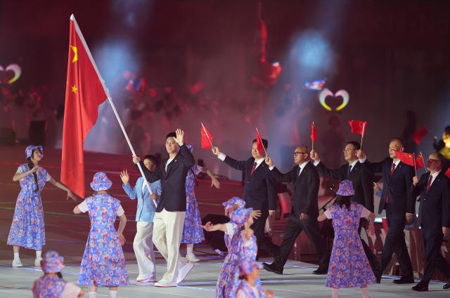 (260919) -- NAGOYA, Sept. 19, 2026 (Xinhua) -- The delegation of China parades into the stadium during the opening ceremony of the 20th Asian Games Aichi-Nagoya 2026 in Nagoya, Japan, Sept. 19, 2026. (Xinhua/Lui Siu Wai)