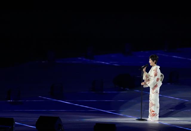 (260919) -- NAGOYA, Sept. 19, 2026 (Xinhua) -- Toda Keiko of Japan sings the national anthem during the opening ceremony of the 20th Asian Games Aichi-Nagoya 2026 in Nagoya, Japan, Sept. 19, 2026. (Xinhua/Lui Siu Wai)
