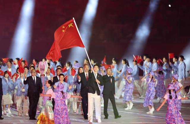 (260919) -- NAGOYA, Sept. 19, 2026 (Xinhua) -- Delegation of China parades into the stadium during the opening ceremony of the 20th Asian Games Aichi-Nagoya 2026 in Nagoya, Japan, Sept. 19, 2026. (Xinhua/Deng Hua)