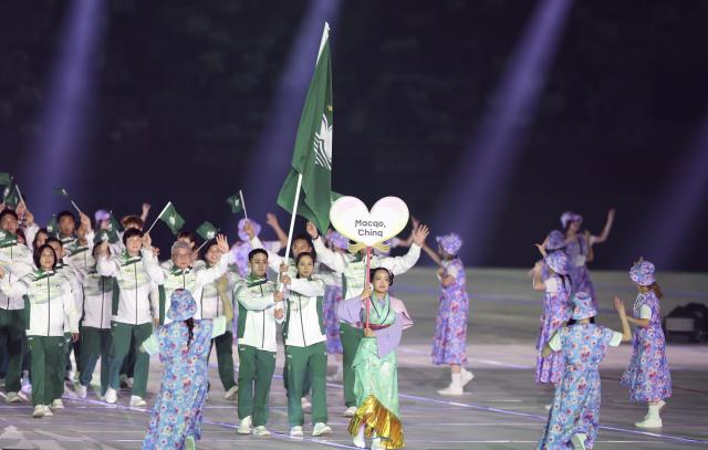 (260919) -- NAGOYA, Sept. 19, 2026 (Xinhua) -- The delegation of Macao of China parades during the opening ceremony of the 20th Asian Games Aichi-Nagoya 2026 in Nagoya, Japan, Sept. 19, 2026. (Xinhua/Deng Hua)