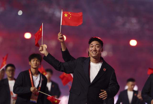(260919) -- NAGOYA, Sept. 19, 2026 (Xinhua) -- The delegation of China parades into the stadium during the opening ceremony of the 20th Asian Games Aichi-Nagoya 2026 in Nagoya, Japan, Sept. 19, 2026. (Xinhua/Jia Haocheng)