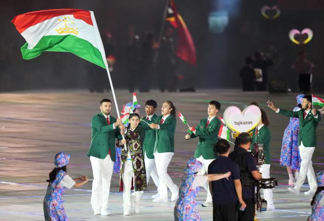 (260919) -- NAGOYA, Sept. 19, 2026 (Xinhua) -- The delegation of Tajikistan parades into the stadium during the opening ceremony of the 20th Asian Games Aichi-Nagoya 2026 in Nagoya, Japan, Sept. 19, 2026. (Xinhua/Lui Siu Wai)