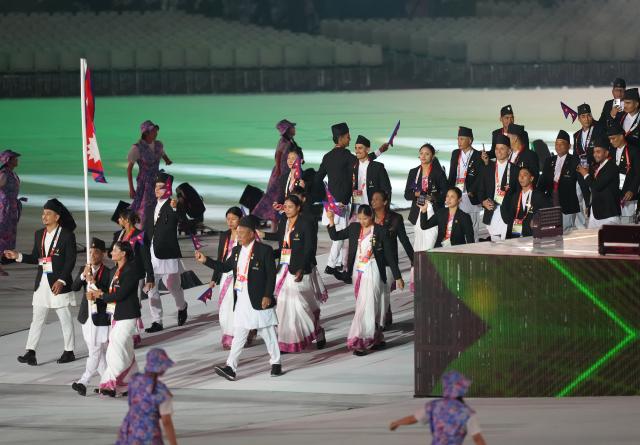 (260919) -- NAGOYA, Sept. 19, 2026 (Xinhua) -- The delegation of Nepal parades into the stadium during the opening ceremony of the 20th Asian Games Aichi-Nagoya 2026 in Nagoya, Japan, Sept. 19, 2026. (Xinhua/Lui Siu Wai)