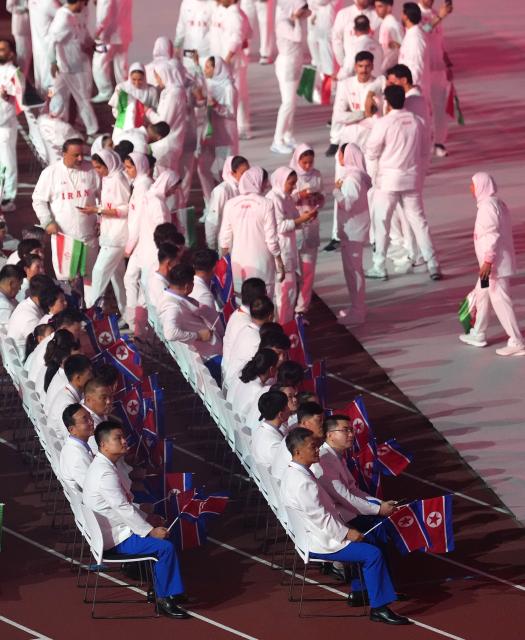 (260919) -- NAGOYA, Sept. 19, 2026 (Xinhua) -- Members of the delegation of Iran (top) and the Democratic People's Republic of Korea attend the opening ceremony of the 20th Asian Games Aichi-Nagoya 2026 in Nagoya, Japan, Sept. 19, 2026. (Xinhua/Lui Siu Wai)