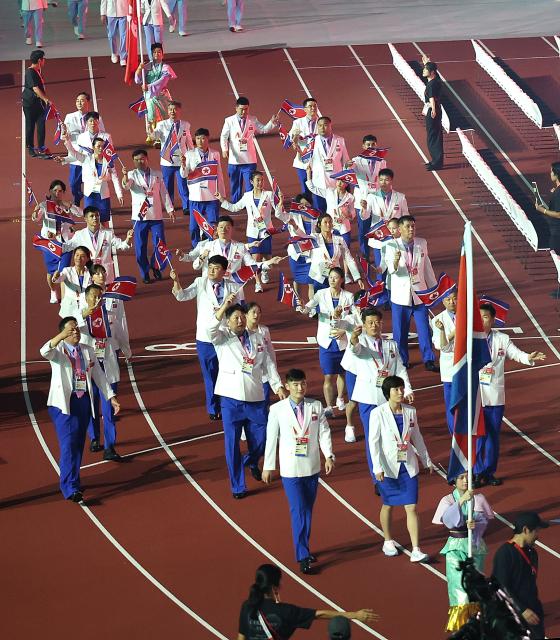 (260919) -- NAGOYA, Sept. 19, 2026 (Xinhua) -- The delegation of the Democratic People's Republic of Korea parades during the opening ceremony of the 20th Asian Games Aichi-Nagoya 2026 in Nagoya, Japan, Sept. 19, 2026. (Xinhua/Yao Qilin)