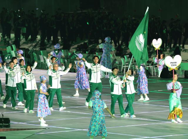 (260919) -- NAGOYA, Sept. 19, 2026 (Xinhua) -- The delegation of Macao of China parades during the opening ceremony of the 20th Asian Games Aichi-Nagoya 2026 in Nagoya, Japan, Sept. 19, 2026. (Xinhua/Yao Qilin)
