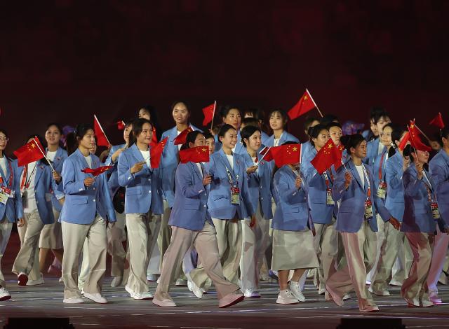 (260919) -- NAGOYA, Sept. 19, 2026 (Xinhua) -- Delegation of China parades into the stadium during the opening ceremony of the 20th Asian Games Aichi-Nagoya 2026 in Nagoya, Japan, Sept. 19, 2026. (Xinhua/Li Bo)