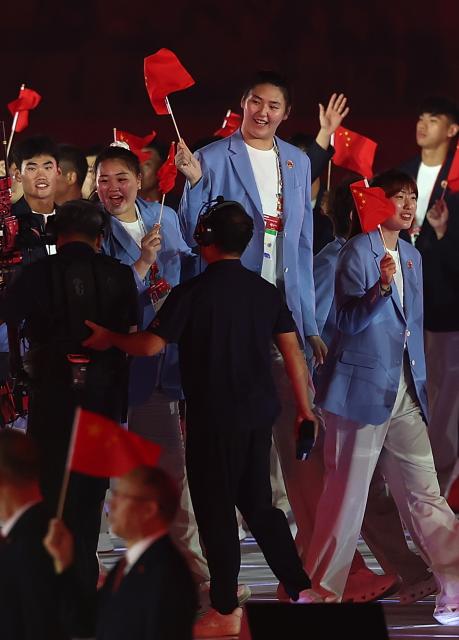 (260919) -- NAGOYA, Sept. 19, 2026 (Xinhua) -- Delegation of China parades into the stadium during the opening ceremony of the 20th Asian Games Aichi-Nagoya 2026 in Nagoya, Japan, Sept. 19, 2026. (Xinhua/Li Bo)