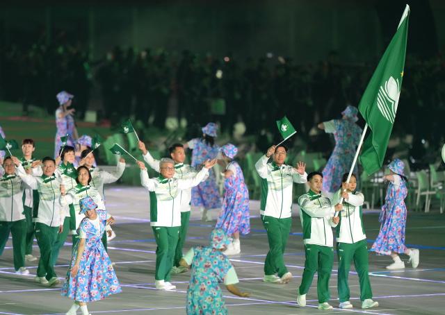 (260919) -- NAGOYA, Sept. 19, 2026 (Xinhua) -- The delegation of Macao of China parades into the stadium during the opening ceremony of the 20th Asian Games Aichi-Nagoya 2026 in Nagoya, Japan, Sept. 19, 2026. (Xinhua/Lui Siu Wai)