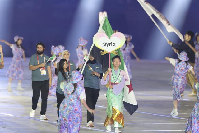 (260919) -- NAGOYA, Sept. 19, 2026 (Xinhua) -- The delegation of Syria parades during the opening ceremony of the 20th Asian Games Aichi-Nagoya 2026 in Nagoya, Japan, Sept. 19, 2026. (Xinhua/Deng Hua)