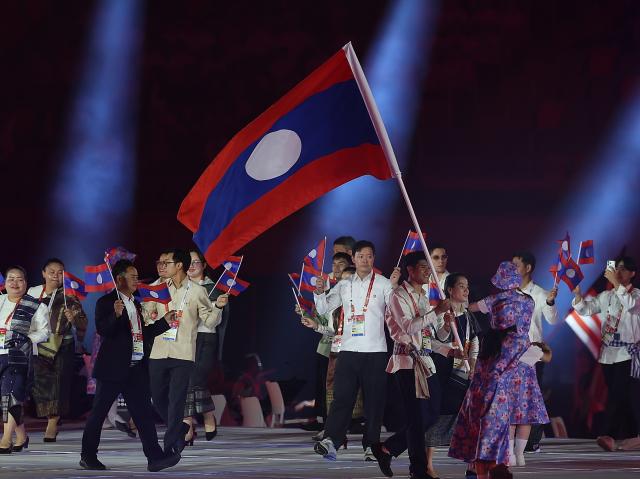 (260919) -- NAGOYA, Sept. 19, 2026 (Xinhua) -- The delegation of the Lao People's Democratic Republic parades into the stadium during the opening ceremony of the 20th Asian Games Aichi-Nagoya 2026 in Nagoya, Japan, Sept. 19, 2026. (Xinhua/Li Bo)