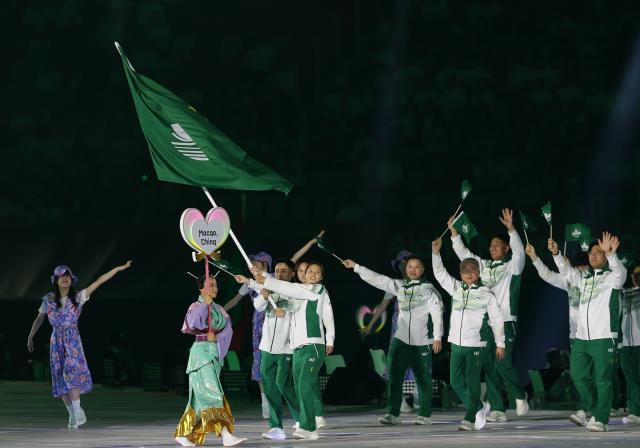 (260919) -- NAGOYA, Sept. 19, 2026 (Xinhua) -- The delegation of Macao of China parades into the stadium during the opening ceremony of the 20th Asian Games Aichi-Nagoya 2026 in Nagoya, Japan, Sept. 19, 2026. (Xinhua/Li Bo)