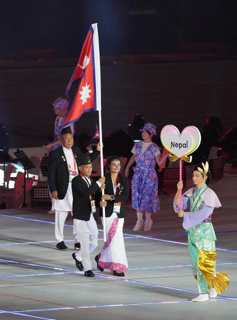 (260919) -- NAGOYA, Sept. 19, 2026 (Xinhua) -- The delegation of Nepal parades into the stadium during the opening ceremony of the 20th Asian Games Aichi-Nagoya 2026 in Nagoya, Japan, Sept. 19, 2026. (Xinhua/Zhou Mi)