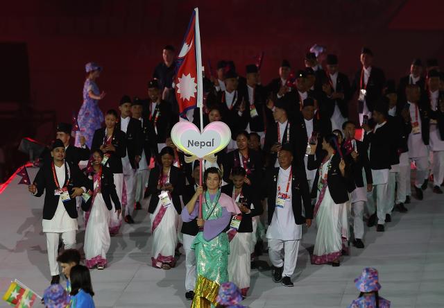 (260919) -- NAGOYA, Sept. 19, 2026 (Xinhua) -- The delegation of Nepal parades into the stadium during the opening ceremony of the 20th Asian Games Aichi-Nagoya 2026 in Nagoya, Japan, Sept. 19, 2026. (Xinhua/Li Bo)
