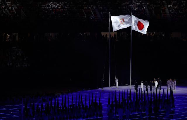 (260919) -- NAGOYA, Sept. 19, 2026 (Xinhua) -- The Japanese national flag and the Olympic Council of Asia (OCA) flag are raised during the opening ceremony of the 20th Asian Games Aichi-Nagoya 2026 in Nagoya, Japan, Sept. 19, 2026. (Xinhua/Wang Fei)
